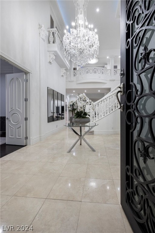 tiled foyer entrance with a high ceiling