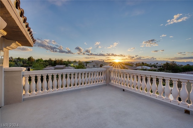 patio terrace at dusk with a balcony