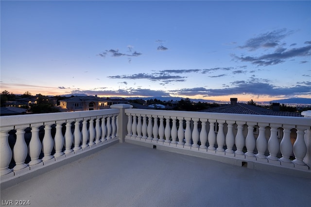 patio terrace at dusk with a balcony