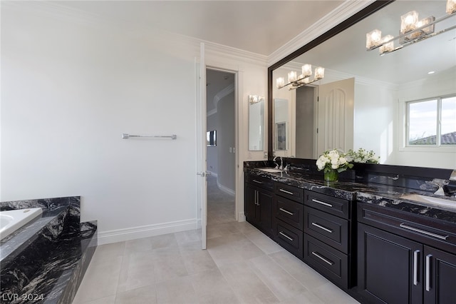 bathroom featuring crown molding, vanity, tile patterned flooring, and a washtub