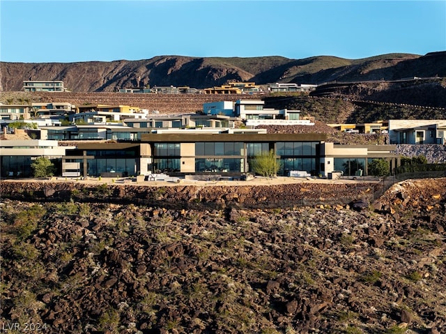 back of property featuring a mountain view