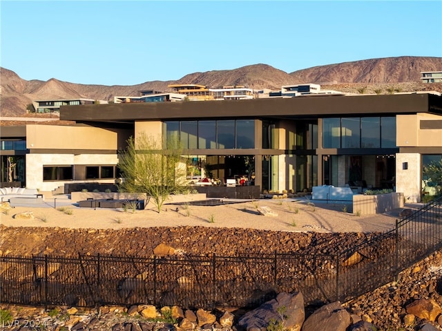 rear view of house with a mountain view