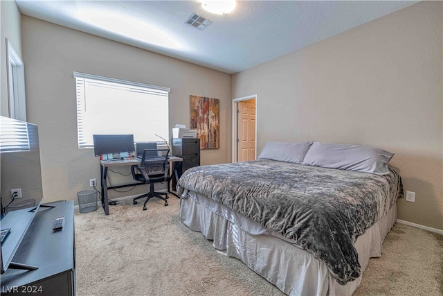 bedroom with light carpet