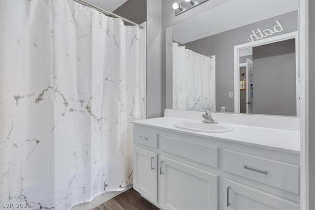 bathroom featuring vanity and hardwood / wood-style floors