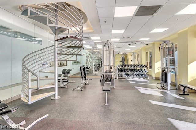 exercise room featuring a drop ceiling