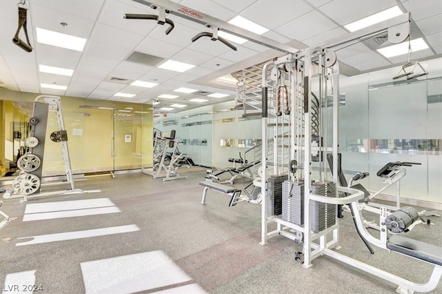 workout area with a paneled ceiling