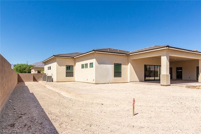 back of house with a patio area and cooling unit