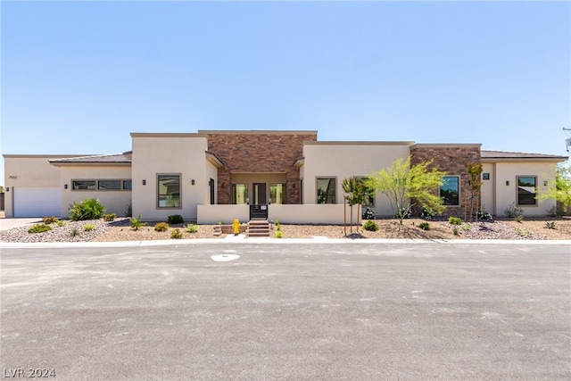 southwest-style home with a garage