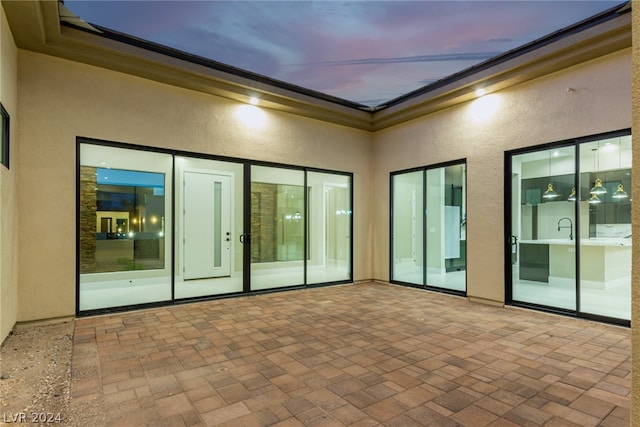 view of patio terrace at dusk