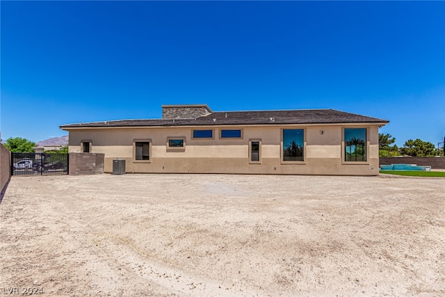 back of property with central air condition unit