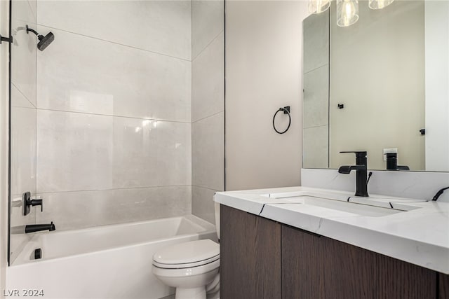 full bathroom with vanity, toilet, and tiled shower / bath combo