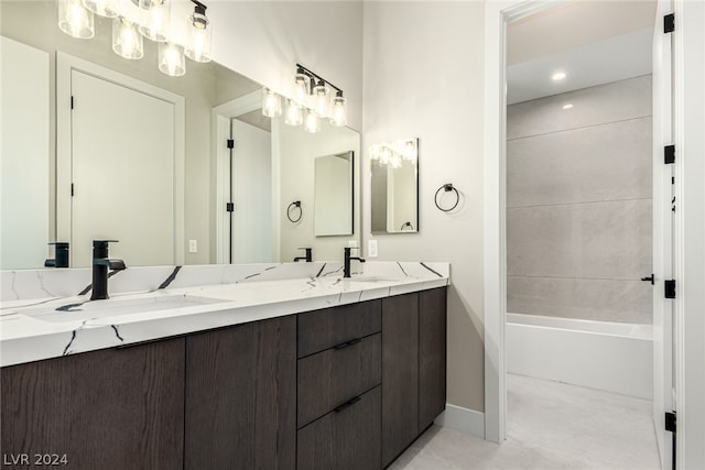 bathroom featuring tile flooring, bathtub / shower combination, and double sink vanity