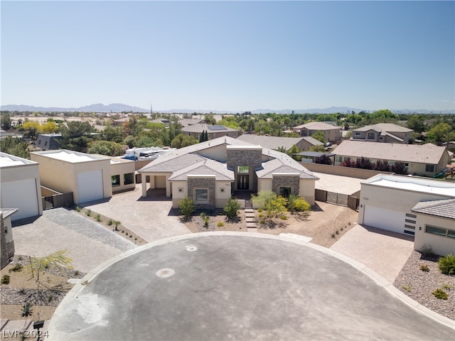 exterior space featuring a garage and a mountain view