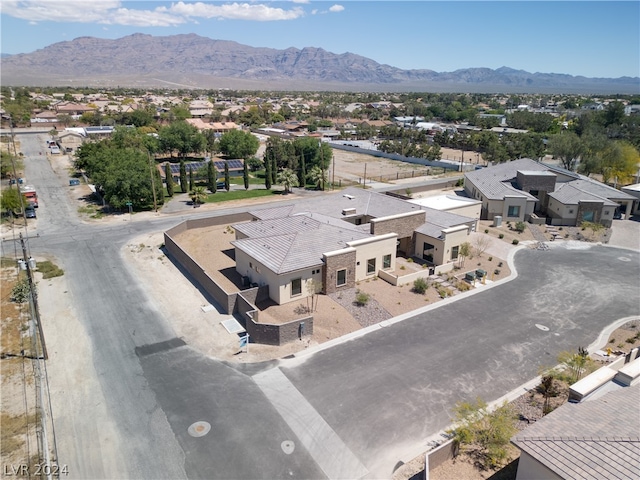 birds eye view of property with a mountain view