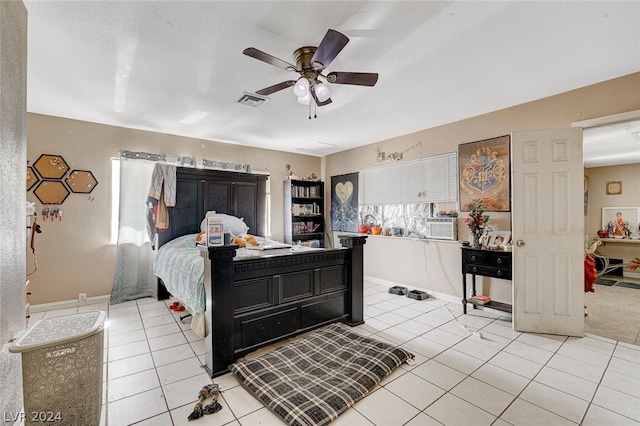 bedroom featuring ceiling fan and light tile floors