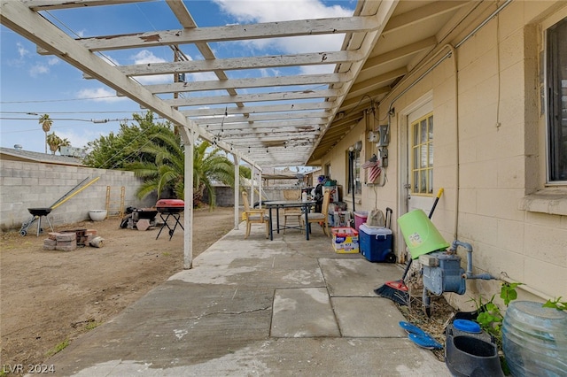 view of terrace featuring a pergola