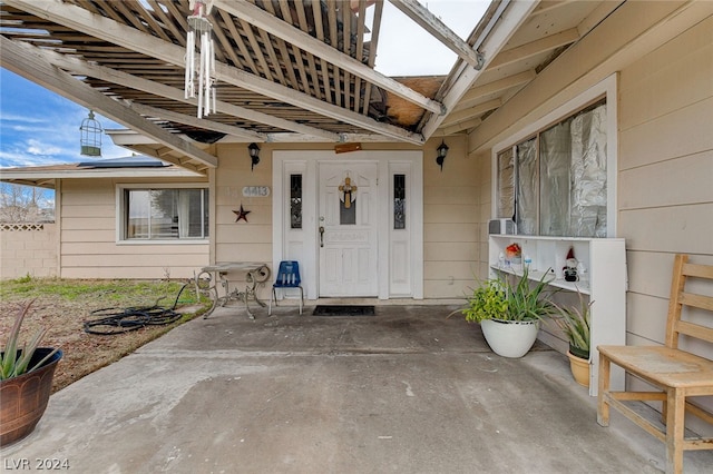 property entrance with a patio area