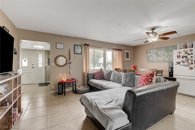 living room featuring ceiling fan and light tile floors