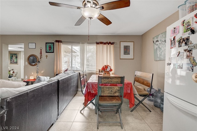 dining space featuring ceiling fan and light tile flooring