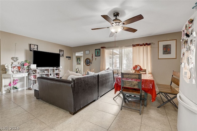 living room featuring ceiling fan and light tile floors