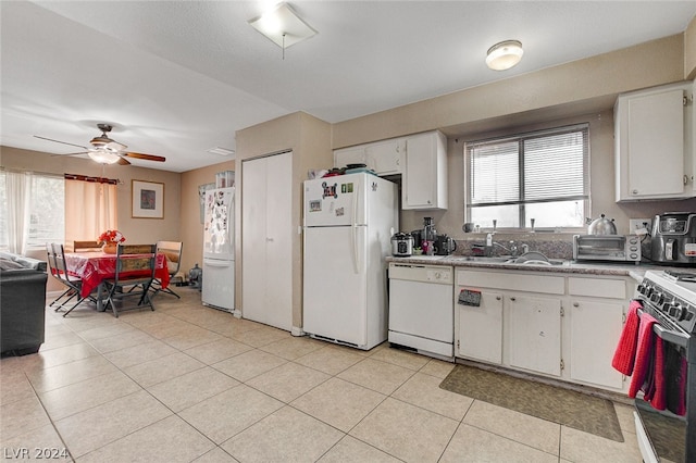 kitchen with white appliances, ceiling fan, white cabinetry, sink, and light tile floors