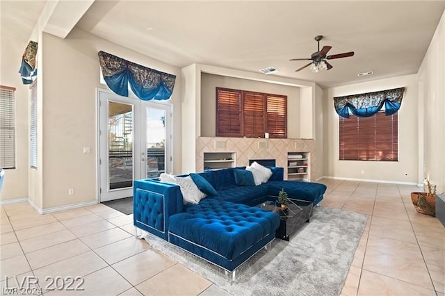 tiled living room featuring ceiling fan