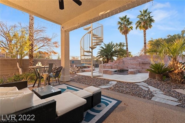 view of patio featuring an outdoor living space and ceiling fan