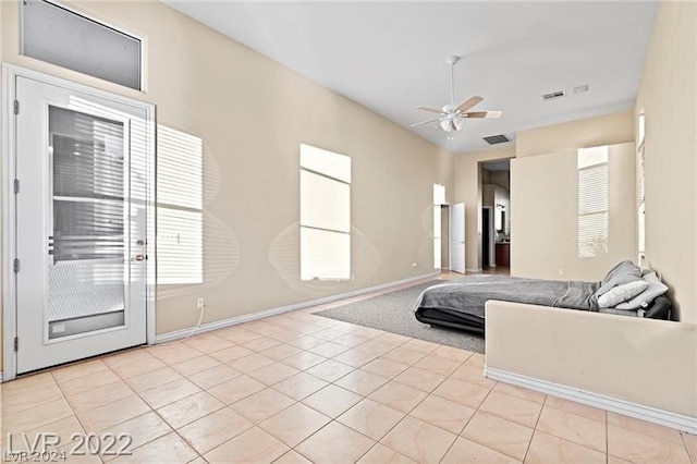 tiled living room featuring ceiling fan