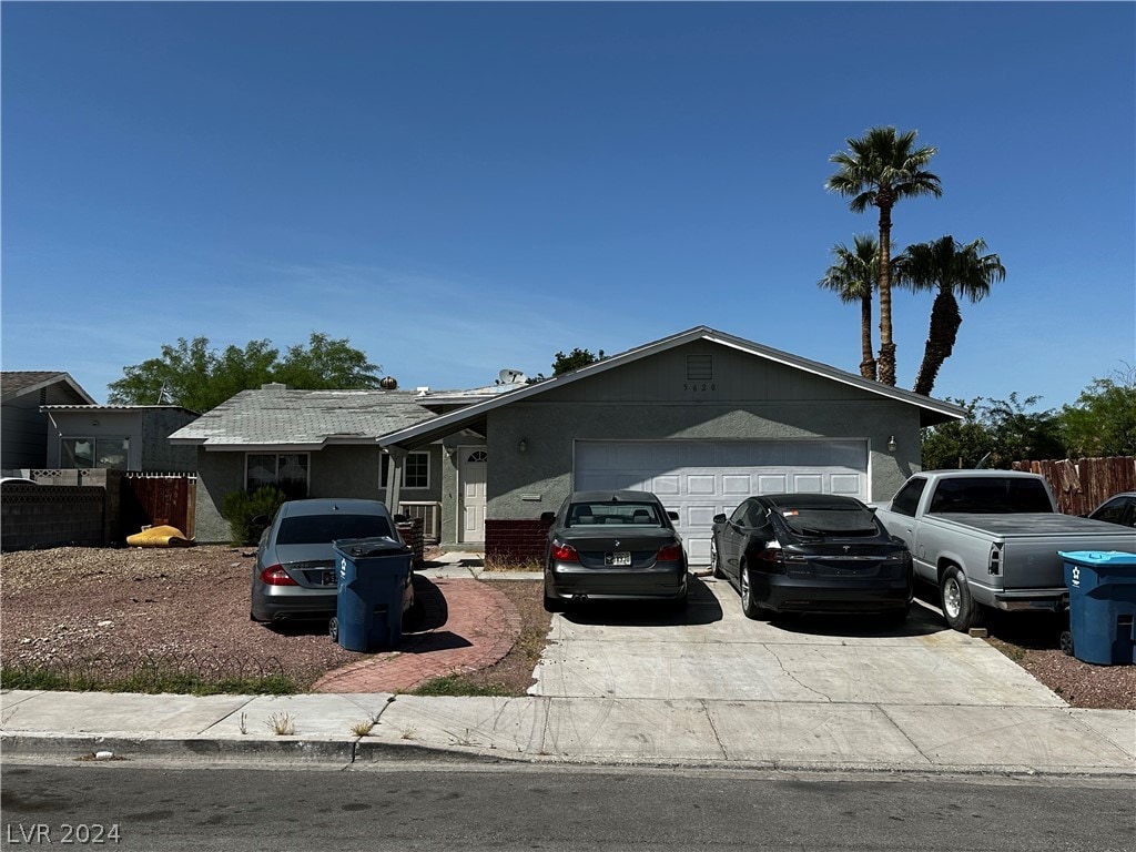 ranch-style home featuring a garage