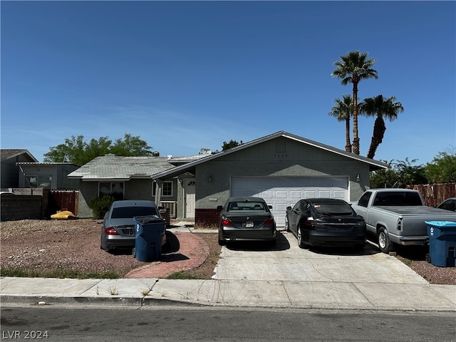 ranch-style home featuring a garage