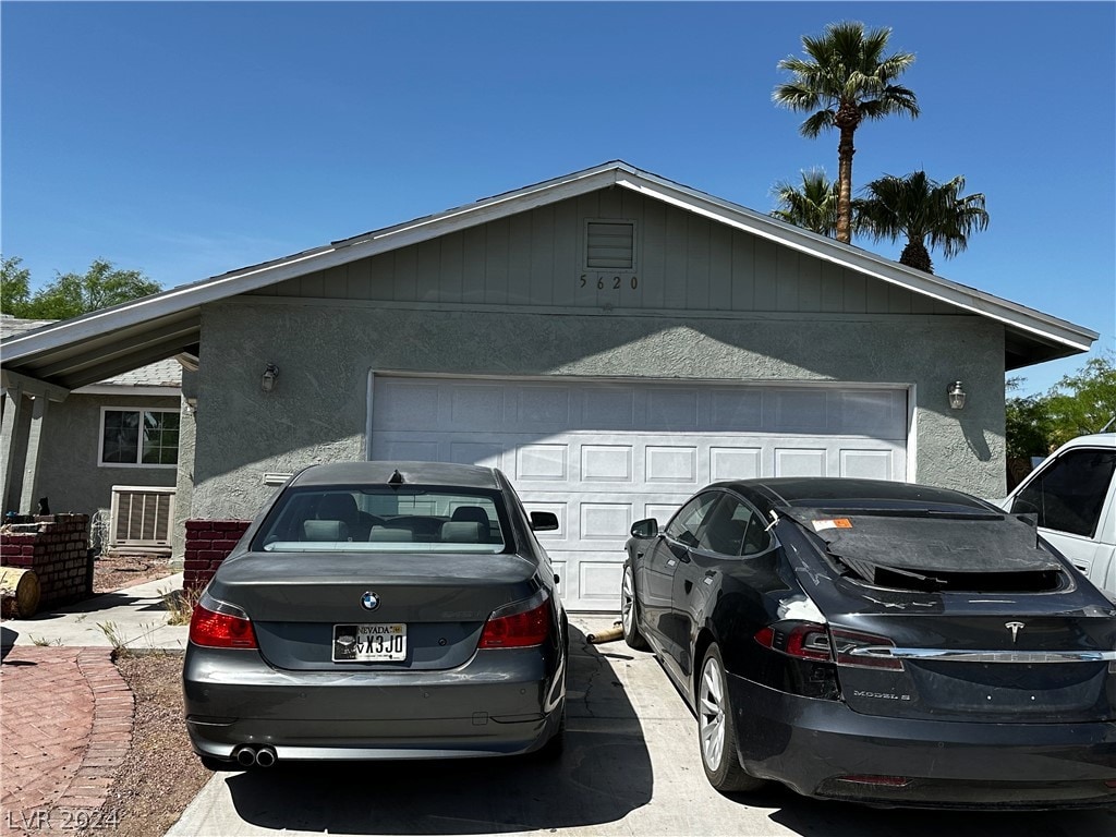 view of side of home with a garage