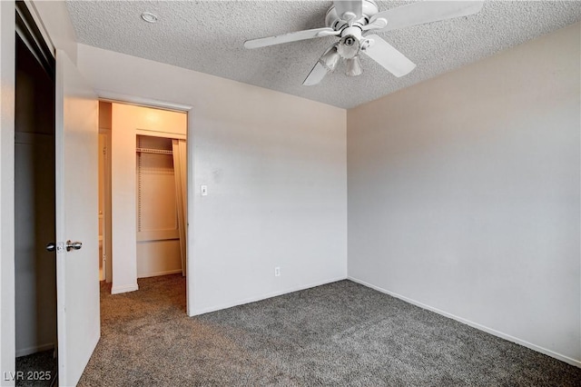 unfurnished bedroom with a textured ceiling, a ceiling fan, baseboards, and carpet floors