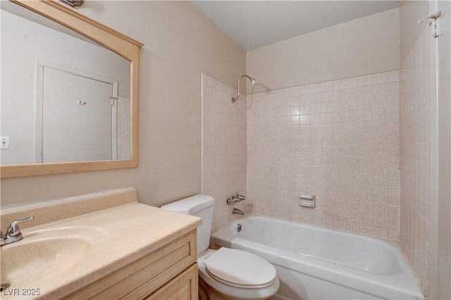 bathroom featuring vanity, toilet, and washtub / shower combination