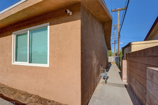 view of side of home with a patio area