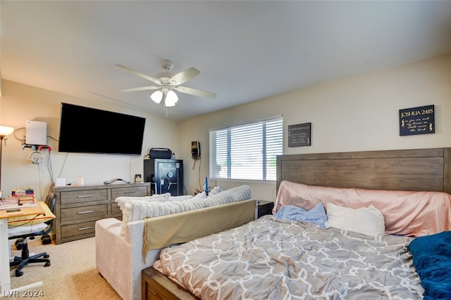 bedroom featuring light carpet and ceiling fan