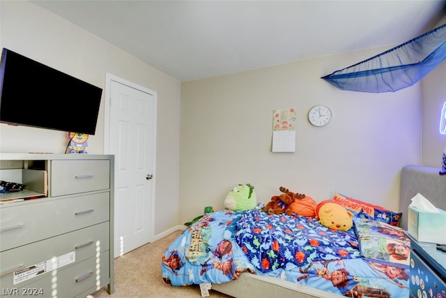 bedroom with light colored carpet