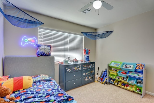 bedroom with light colored carpet and ceiling fan