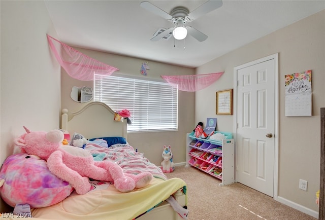 bedroom featuring ceiling fan and carpet