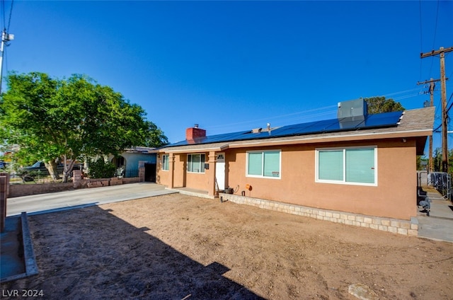 back of property with solar panels