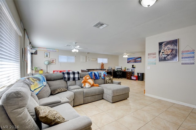 tiled living room featuring ceiling fan