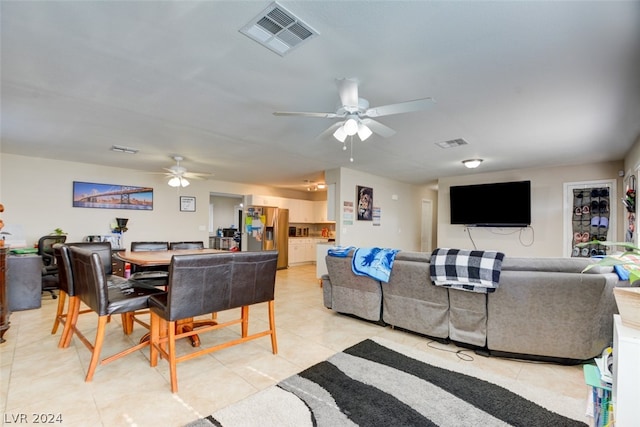 tiled dining space with ceiling fan