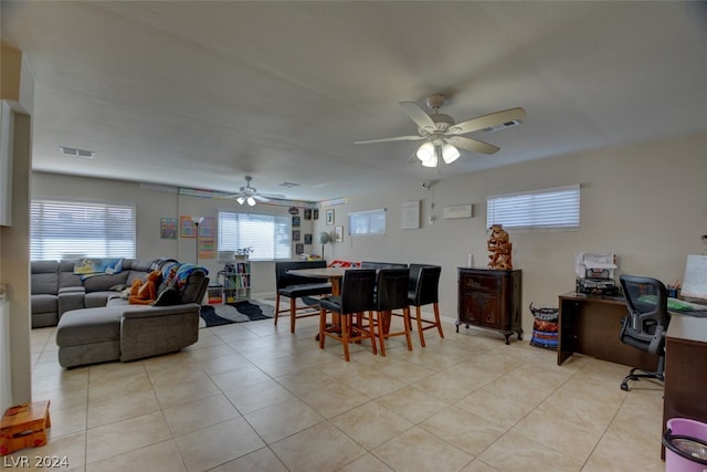 living room with ceiling fan and light tile flooring