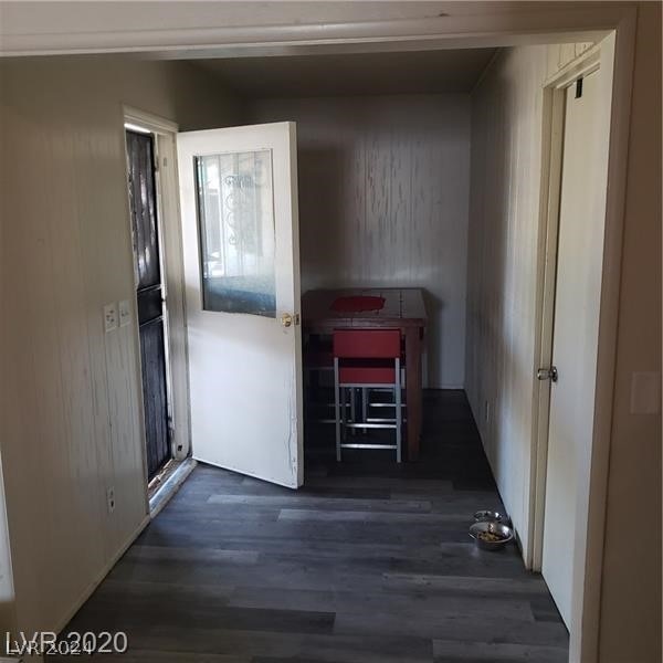 hallway featuring dark hardwood / wood-style flooring