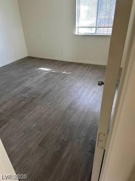 empty room featuring dark hardwood / wood-style floors