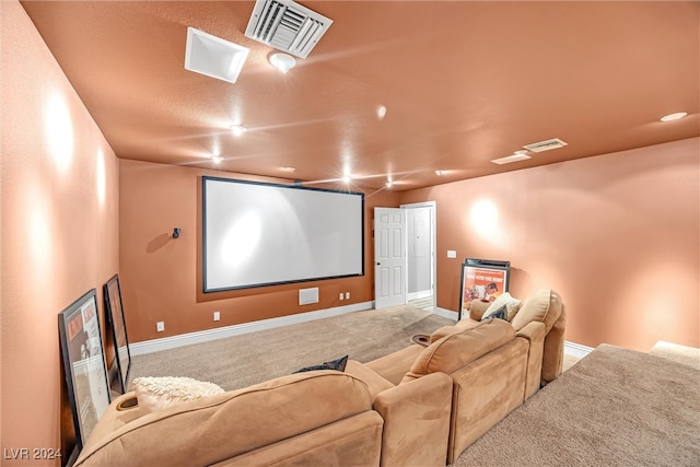 cinema room featuring baseboards, visible vents, and carpet flooring