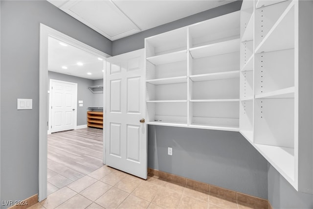 spacious closet featuring light wood-type flooring