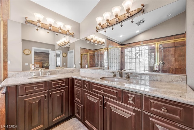 full bath featuring a shower stall, visible vents, vaulted ceiling, and a sink