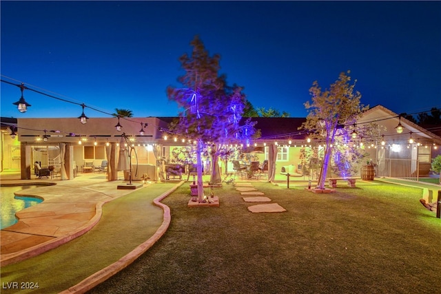 yard at twilight with a patio