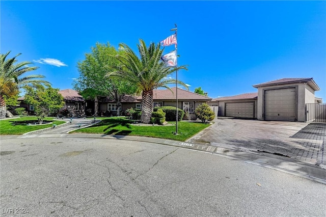 view of front of home featuring driveway, a front lawn, and stucco siding