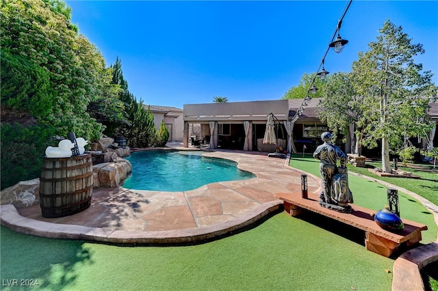 pool with a patio area